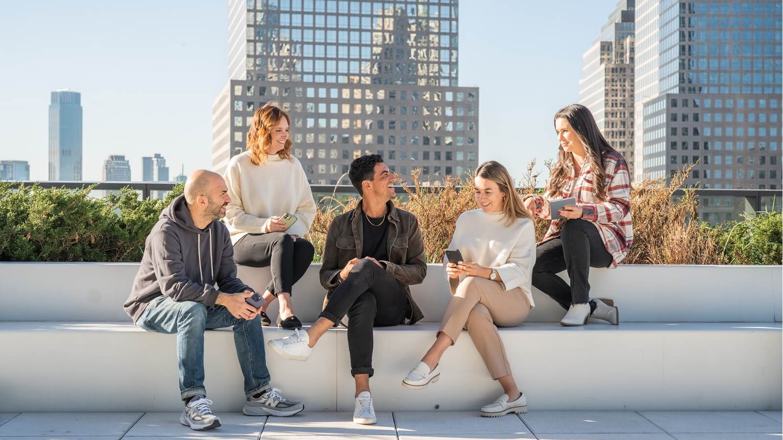 Index Exchange employees outside on bench