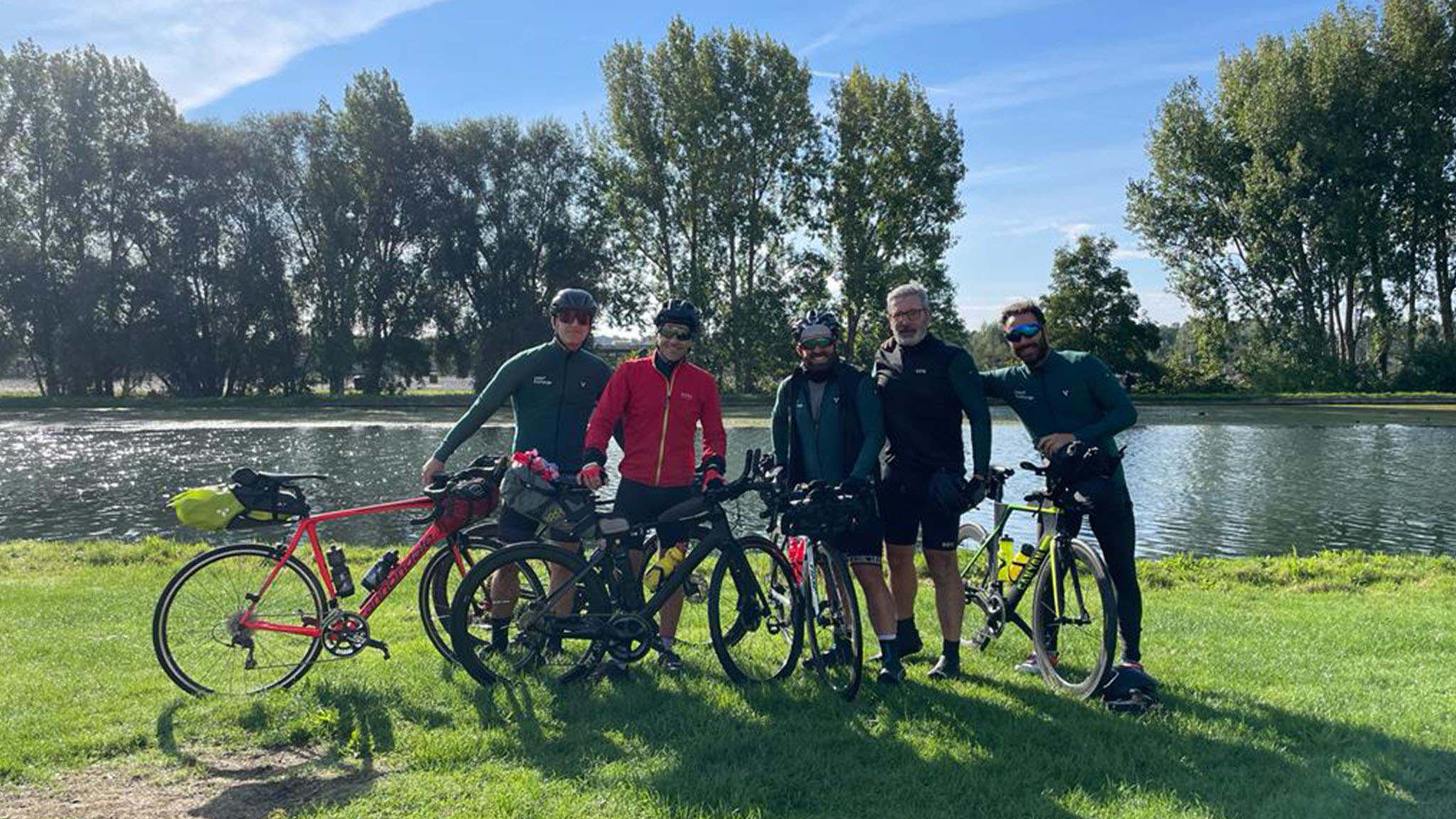 Index Exchange team and partners on cycling trip in France posing with their bikes